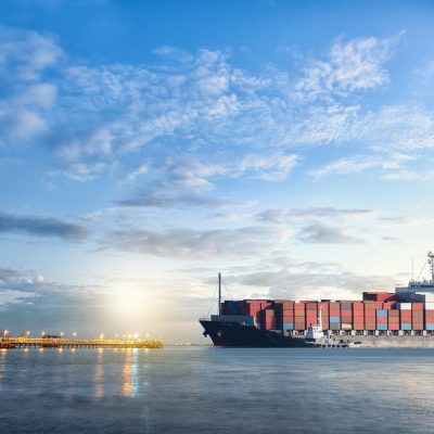 Logistics and transportation of International Container Cargo ship in the ocean at twilight sky, Freight Transportation, Shipping